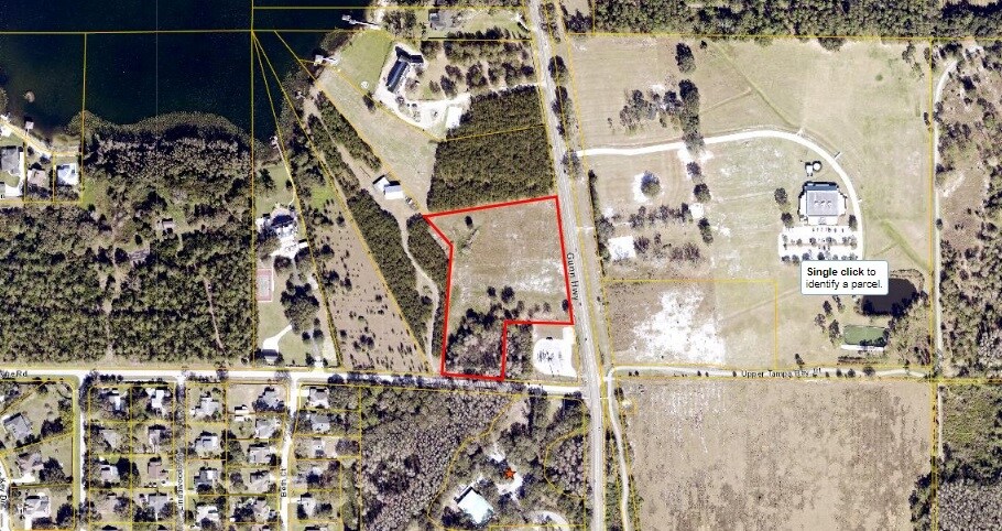 A map view with the 4.7-acre commercial parcel at Gunn Hwy and Wayne Rd clearly outlined in red.
