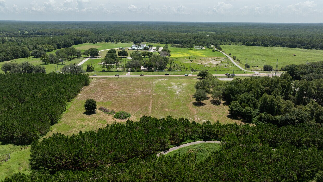 View of Land Across Gunn Highway An aerial perspective from above the property looking across Gunn Highway at the surrounding rural and residential landscape.