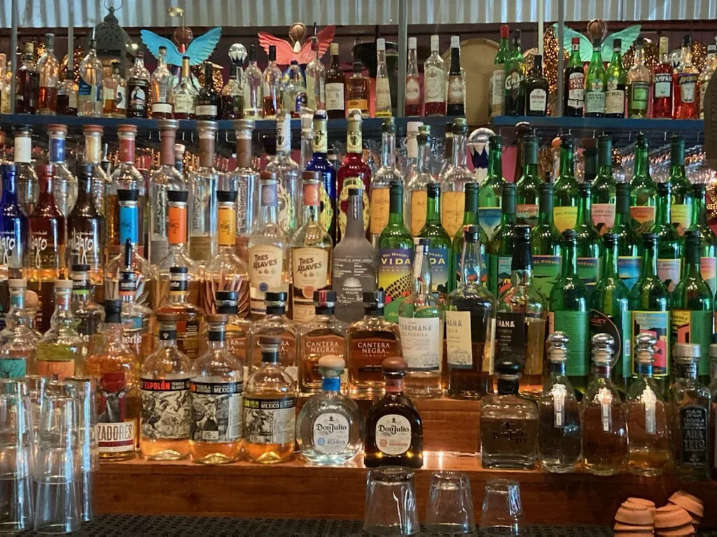 An interior view of the fully stocked bar at the restaurant, showcasing an extensive collection of tequila and other spirits for this turnkey operation.